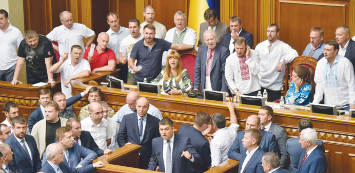 Deputies of the Ukrainian Radical Party block the platform to prevent voting at the parliament in Kiev.