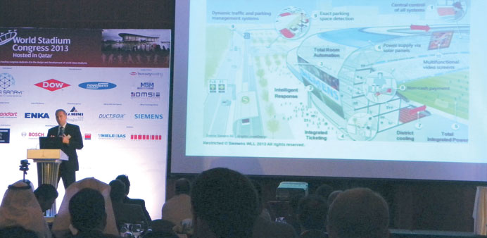 Jan Schoenig of Siemens showing a model of a modern stadium during the World Stadium Congress. PICTURES: Joey Aguilar