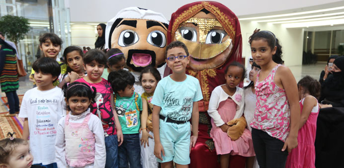 Children pose with their favourite mascots at Ezdan Mall.