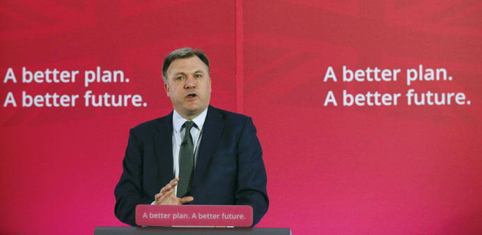 Shadow chancellor of the exchequer Ed Balls gestures as he speaks in central London yesterday.