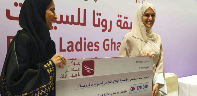 Qatar Ladies Centre members making a donation at the event.