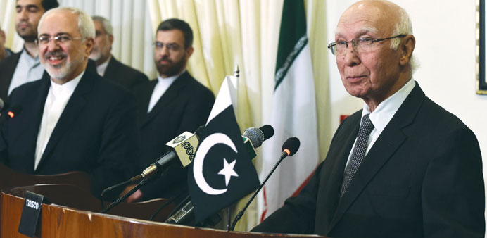 Iranian Foreign Minister Mohamed Javad Zarif listens during a joint press briefing with Adviser to Pakistani Prime Minister on Foreign Affairs, Sartaj