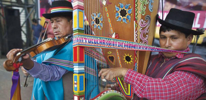 Peruvian indigenous musicians play on a street in Lima.