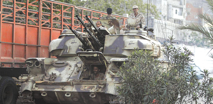 A military vehicle leaves the army headquarters after the attack in Aden yesterday.