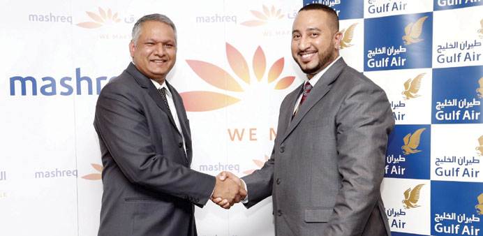  Niranjan Mendonca and Wael Mattar shaking hands after signing the agreement.