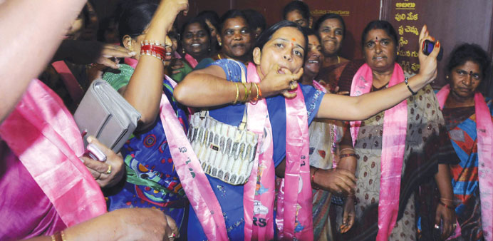  A group of women cheering as they celebrate after the announcement of the separate state of Telangana in the southern Indian city of Hyderabad.