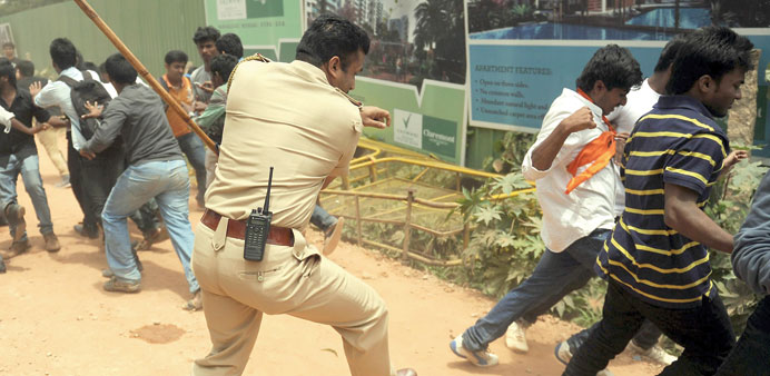 A policeman baton-charging activists of the Akhil Bharatiya Vidyarthi Parishad, the student wing of the Bharatiya Janata Party, during a demonstration