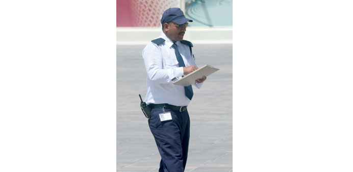 A security guard on duty on an open ground in Doha. PICTURE: Jayaram