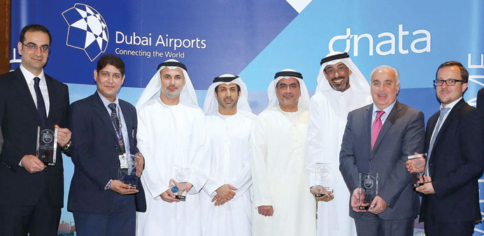Chehade Saad (second right) accepts the u2018Goldu2019 award on behalf of the airline for its on-time performance.