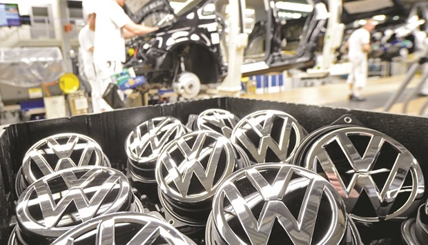 Emblems of Volkswagen Golf VII car are seen in a production line at the companyu2019s plant in Wolfsburg. Europeu2019s biggest car maker said yesterday operating profit before one-off items fell 5.9% to u20ac3.1bn ($3.5bn) on a 3.4% drop in sales revenues.