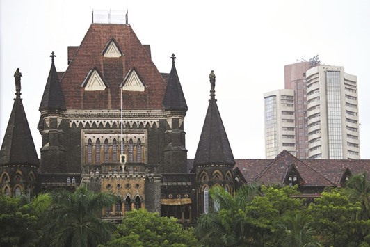 The Bombay Stock Exchange building (right) is seen behind the Bombay High Court building in Mumbai. Traders are shrugging off the most expensive stock valuations since 2011, sending Indian shares back towards a bull market amid forecasts for the strongest monsoon in two decades and data showing the nation growing faster than all other major economies.