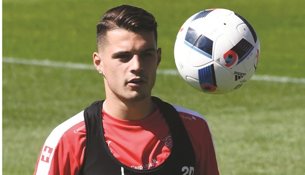 Switzerlandu2019s midfielder Granit Xhaka practices during a training session at the teamu2019s training ground in Montpellier.
