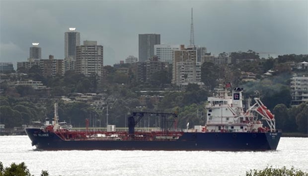 A ship sails on Sydney Harbour in Sydney on Wednesday. Australia's economy has defied market forecasts with stronger-than-predicted expansion in January-March, driven by net exports and household spending.