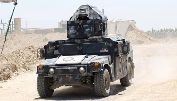 An Iraqi security military vehicle is seen on the outskirts of Fallujah on Saturday.