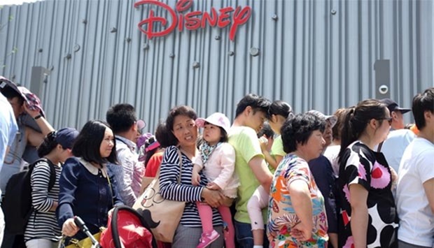 People queue to enter China's first Disney store at Pudong financial district in Shanghai last month.