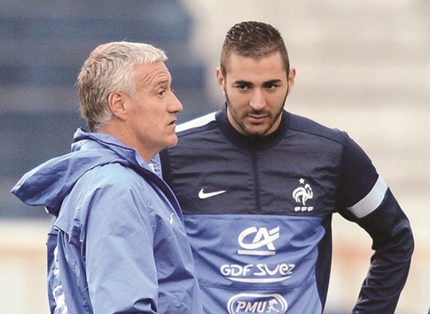 Didier Deschamps (left) did not pick Karim Benzema because he is under investigation over an alleged sex-tape blackmail case. (AFP)