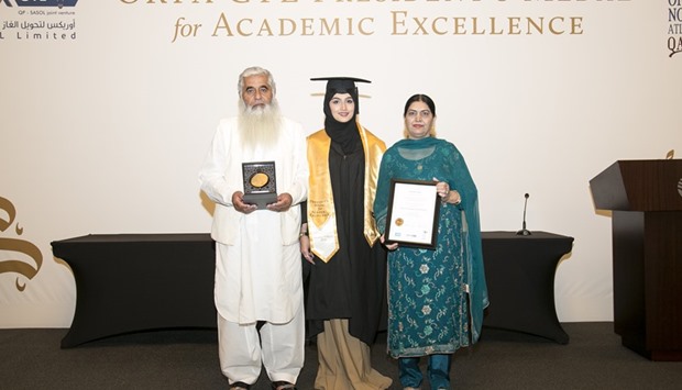 DETERMINED: Khadija Salim, centre, with her parents at the Presidentsu2019 Medal awards.