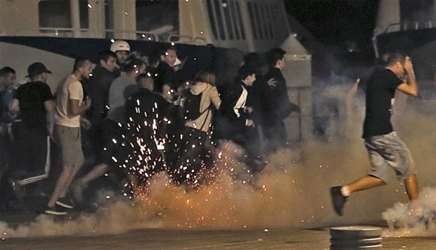 Police disperse revellers at the old port of Marseille after the England vs Russia - Group B match