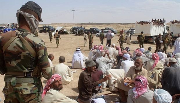 Displaced Iraqis who were evacuated from their villages by Iraqi government forces south of the besieged Islamic State (IS) group bastion of Fallujah rest at a safe zone in Subayat during a military operation to retake territory from the jihadists.