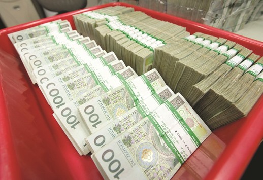 Trays of zloty notes wait to be counted at the National Bank of Polandu2019s sorting facility in Warsaw. Topping Glapinskiu2019s agenda are risks to financial stability as Polandu2019s authorities plan to convert $36bn in Swiss franc-denominated mortgages into zloty, with banks set to pick up most if not all of the tab.