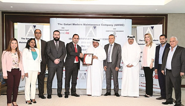 HE Sheikh Faisal bin Qassim al-Thani and other officials at the certification ceremony.