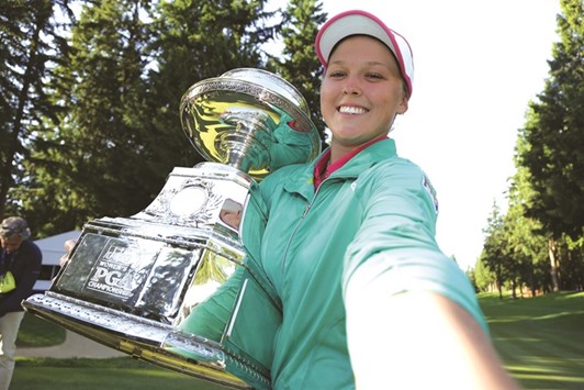 Brooke Henderson of Canada poses for a selfie with the trophy after winning the KPMG Womenu2019s PGA Championship in a playoff against Lydia Ko at Sahalee Country Club in Sammamish, Washington. (Getty Images/AFP)