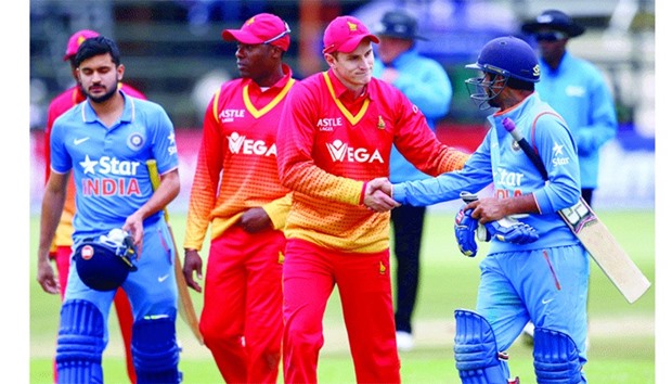 WELL PLAYED: Zimbabweu2019s PJ Moor congratulates Ambati Rayudu (right) after Indiau2019s eight-wicket win in the second ODI series at the Harare Sports Club yesterday. (AFP)