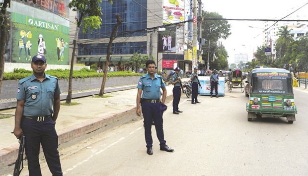 Police standing guard during a nationwide crackdown on militants in Dhaka yesterday.