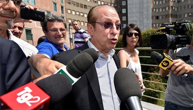 Paolo Berlusconi, brother of Silvio, speaks with journalists outside the San Raffaele Hospital on Tuesday.