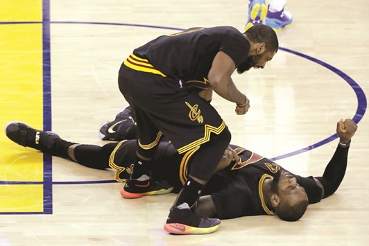 Kyrie Irving (left) celebrates with LeBron James after helping Cleveland Cavaliers to a 112-97 win over the Golden State Warriors in Game 5 of the NBA Finals in Oakland. (AFP)