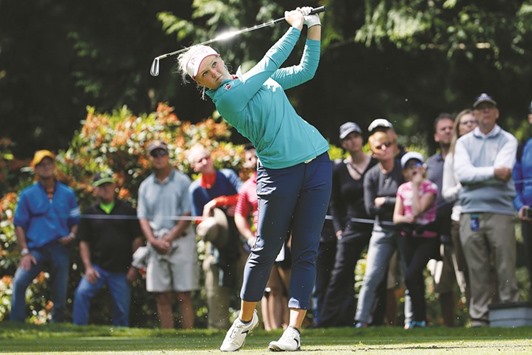 Brooke Henderson hits a tee shot on the 13th hole during the final round of the KPMG Womenu2019s PGA Championship at Sahalee Country Club in Sammamish, Washington. (AFP)