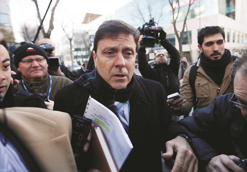 Spanish doctor Eufemiano Fuentes (C) is surrounded by media as he enters a courthouse on the first day of the u2018Operacion Puertou2019 doping trial in Madrid on January 28, 2013. (Reuters)