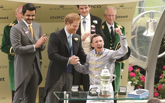 Britainu2019s Prince Harry congratulates jockey Frankie Dettori in the presence of HE Sheikh Joaan bin Hamad al-Thani after the Italian jockey rode Al Shaqab Racingu2019s Galileo Gold to victory in the St Jamesu2019s Palace Stakes, part of the Royal Ascot meeting, in Ascot, United Kingdom, yesterday. (Reuters)