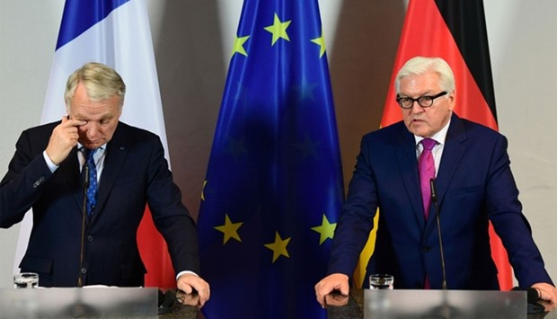 German Foreign minister Frank-Walter Steinmeier (R) and his French counterpart Jean-Marc Ayrault give a press statement during their meeting on June 15, 2016 at the archaeological museum in Brandenburg an der Havel, near Berlin