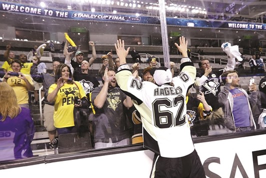 File picture of Carl Hagelin of the Pittsburgh Penguins celebrating with fans after defeating San Jose sharks to win the Stanley Cup.