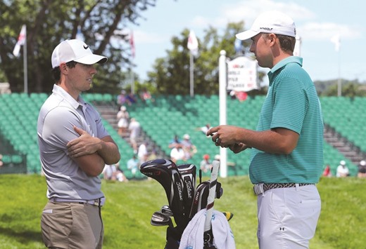 Rory McIlroy of Northern Ireland (left) and Jordan Spieth of the United States talk on the first hole during a practice round prior to the US Open at Oakmont Country Club in Oakmont, Pennsylvania. (Getty Images/AFP)