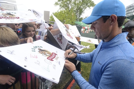 Rory McIlroy signs autographs for fans during the practice rounds of the 2016 US Open golf at Oakmont. PICTURE: USA TODAY Sports