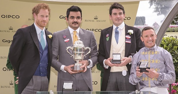 Britainu2019s Prince Harry with HE Sheikh Joaan bin Hamad al-Thani, Galileo Gold trainer Hugo Palmer and jockey Frankie Dettori at the prize distribution ceremony.