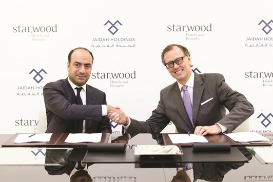 Senior executives of Jaidah Holdings and Starwood at the agreement signing.