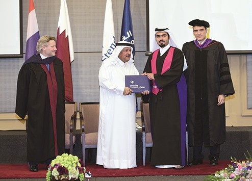HE Sheikh Faisal honouring a graduate.