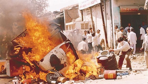 An auto rickshaw goes up in flames during the 2002 Gujarat riots.