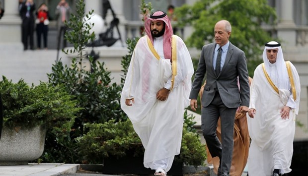 Saudi Arabia's Deputy Crown Prince and Minister of Defense Mohammed Bin Salman (L) arrives at the Oval Office of the White House for a meeting with US President Barack Obama in Washington.