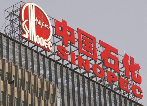 The Sinopec headquarters in Beijing. The refiner will reduce its capacity by 50%, or about 120,000 bpd, for the G20 event, a document from the environment bureau said yesterday.