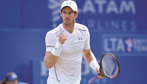 Britainu2019s Andy Murray celebrates beating Britainu2019s Kyle Edmund.