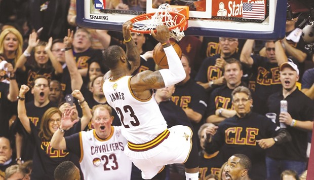 Cleveland Cavaliers forward LeBron James (T) dunks the ball against the Golden State Warriors during Game 6 of the NBA Finals in Cleveland, Ohio, on Thursday.