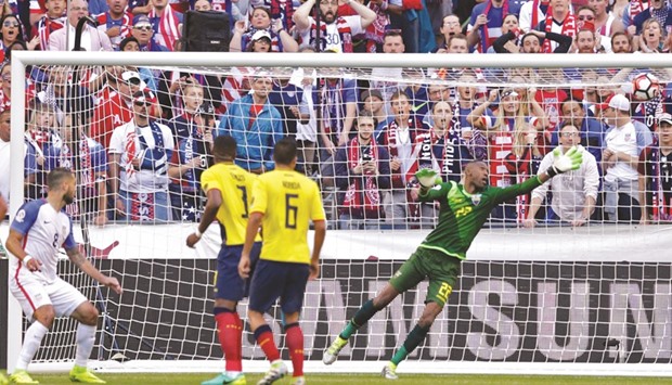 USAu2019s Clint Dempsey (left) scores the first goal against Ecuador during their Copa America Centenario quarter-final match in Seattle yesterday. USA won 2-1. (AFP)