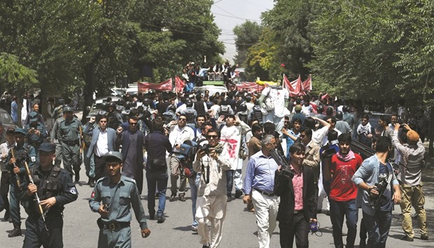 Afghan protesters chanting anti-government slogans during a demonstration against Taliban militants and the kidnapping of civilians in the northeast, at Shar-e-Naw Park in Kabul yesterday.