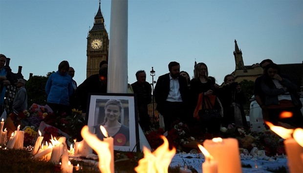 Mourners leave candles in memory of murdered Labour Party MP Jo Cox, in London