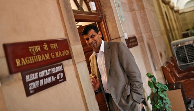 Raghuram Rajan stands outside his room at the finance ministry in New Delhi.  August 6, 2013 file picture.