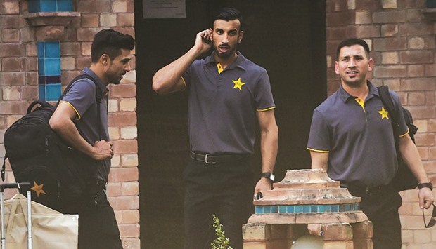 Pakistan fast bowler Mohamed Amir (L) and cricketers Shan Masood (C) and Yasir Shah in Lahore ahead of the team departure for London. (AFP)
